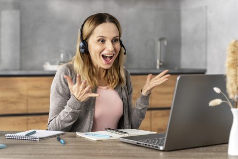 woman-with-headset-working-laptop
